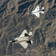 Illustration for article titled These Photos Of Thunderbirds F-16s Flying With F-22 Raptors Is A Whole Lot Of America